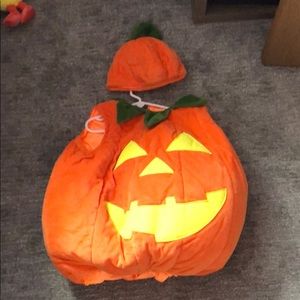 Kids puffy glow in the dark pumpkin costume.